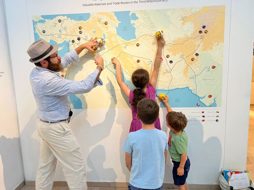 Homeshoolers in the Bible Lands Museum, studying a map of the ancient near east