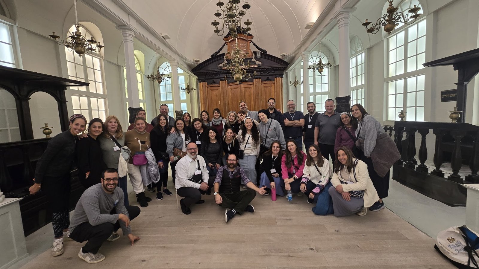 Large public tour group inside the Israel Museum's recreated Italian synagogue